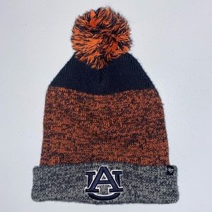 Auburn knit hat with puff ball, gray, navy and orange